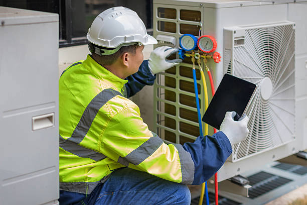 Professional Emergency Hvac Repair technician working in Hampton Bays, NY
